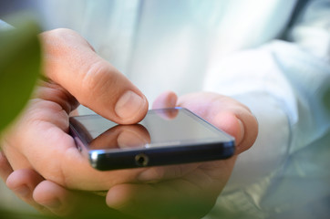 Close up a man  using smart phone outdoor