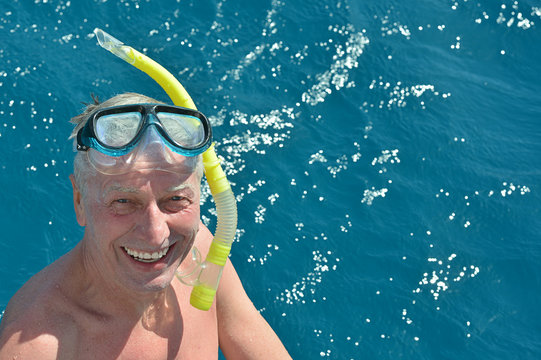 Senior Man At Sea With Snorkeling Mask