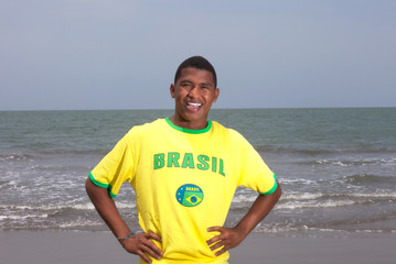 Cheering brazilian guy at beach