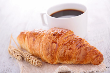 croissant and coffee cup