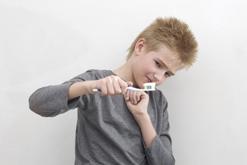 Boy doesn't like to brush teeth a toothbrush