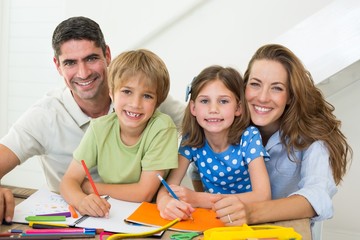 Parents with children drawing at home