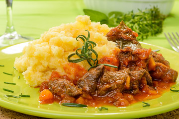 Wild boar with polenta, selective focus, close-up