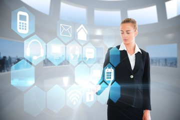 Blonde businesswoman touching app interface