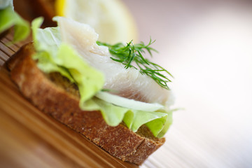 salted herring with onion rings and dill