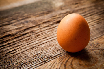 Single egg on wooden table