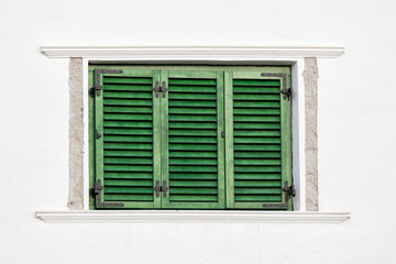 Fototapeta premium Vintage green window on white wall