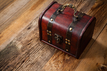 Old chest on wooden table
