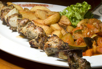 Polish shish kebab shashlik ajapsandali fried potatoes and veget