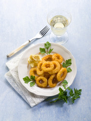 rings squid with parsley and lemon