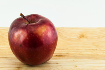 Apple on wooden background