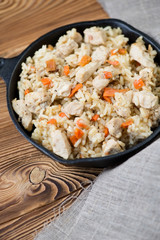 Pilaf with chicken, vertical shot, close-up