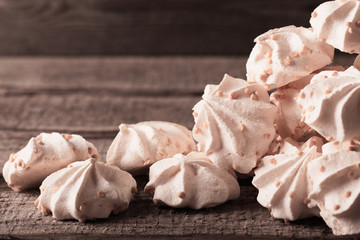 meringue cookies on wooden background