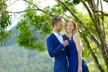 Fototapeta premium Young beautiful couple having fun in a park