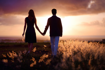 Young couple enjoying the sunset