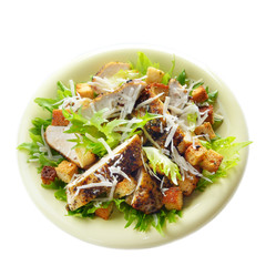 Caesar chicken salad on white background