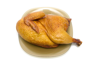 half smoked chicken carcass close up - white background.
