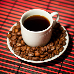 Coffee cup and beans on a table