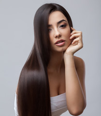 Beautiful Brunette Girl with Healthy Long Hair