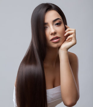 Beautiful Brunette Girl with Healthy Long Hair