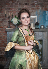 Smiling beautiful woman in medieval dress