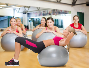 smiling woman with fitness ball