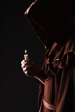 Wizard In Black Cape With Candle