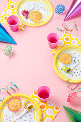 Girl birthday pink table setting with party gadgets