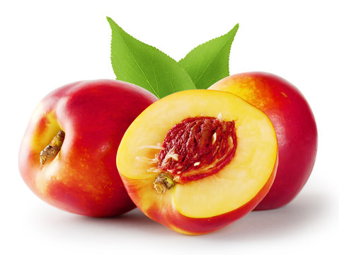 Ripe juicy nectarine with leaves