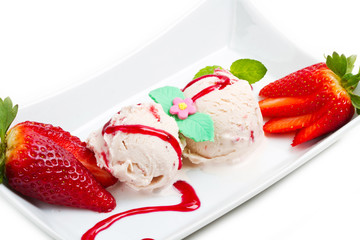 Strawberry ice cream with fruits close up