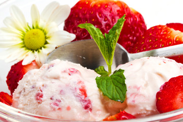 Strawberry ice cream with fruits close up