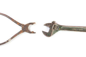 isolated vintage pliers and wrench  on white