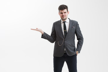 Handsome man makes a gesture with his hand.