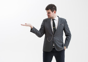 Handsome man makes a gesture with his hand.