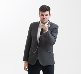 Handsome man makes a gesture with his hand.