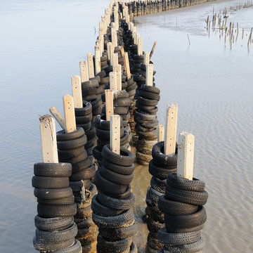 Wave barrier made from many old tires, Protection