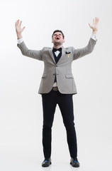 Businessman doing hand gestures. A man raises his hands up.