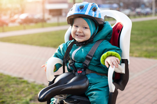 Cheerful Little Boy In A Bike Seat