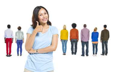 Fototapeta premium Asian Woman Giving Thumbs Up With Group of People