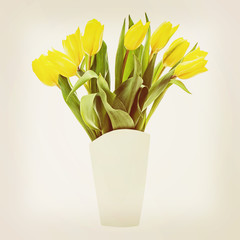 Yellow tulips in vase.