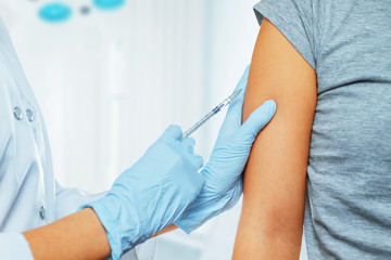 Vaccination in the shoulder - obrazy, fototapety, plakaty