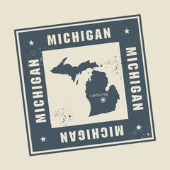 Grunge rubber stamp with name and map of Michigan, USA