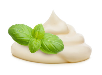 Cream and basil leaves spice isolated on white background.