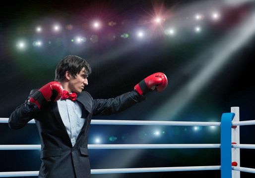 businessman with boxing gloves in the ring
