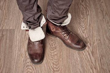 man wearing shoes on a wooden floor