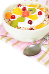 Delicious oatmeal with fruit in bowl on table close-up