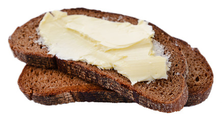 Slices of rye bread with butter, isolated on white