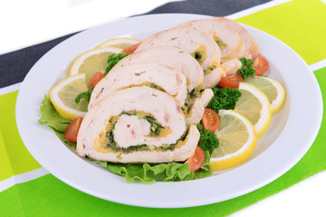Delicious chicken roll on plate on table close-up