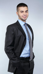 Business man on grey background