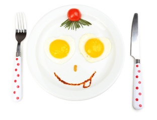 Scrambled eggs with bread on plate, on color napkin